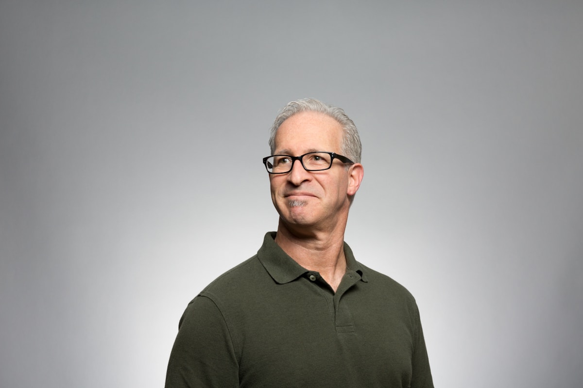 Portrait of an editorial director at the studio table